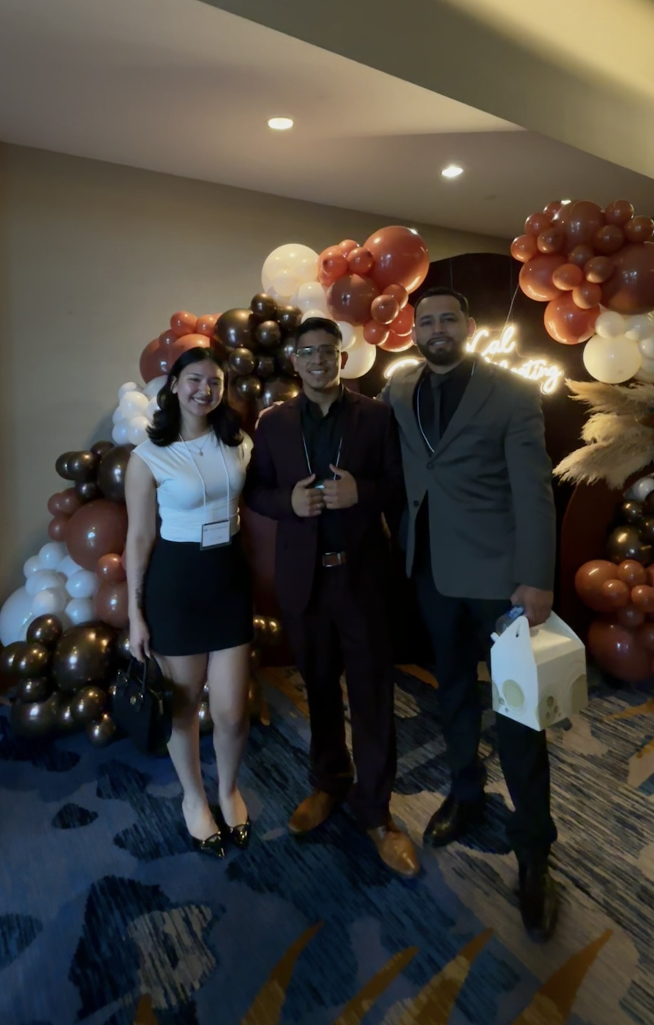 Infinite Reign Solution team members networking at a professional event